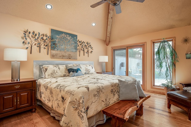 bedroom featuring a textured ceiling, access to exterior, light wood finished floors, and lofted ceiling with beams