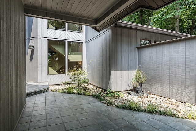 view of side of property with a patio