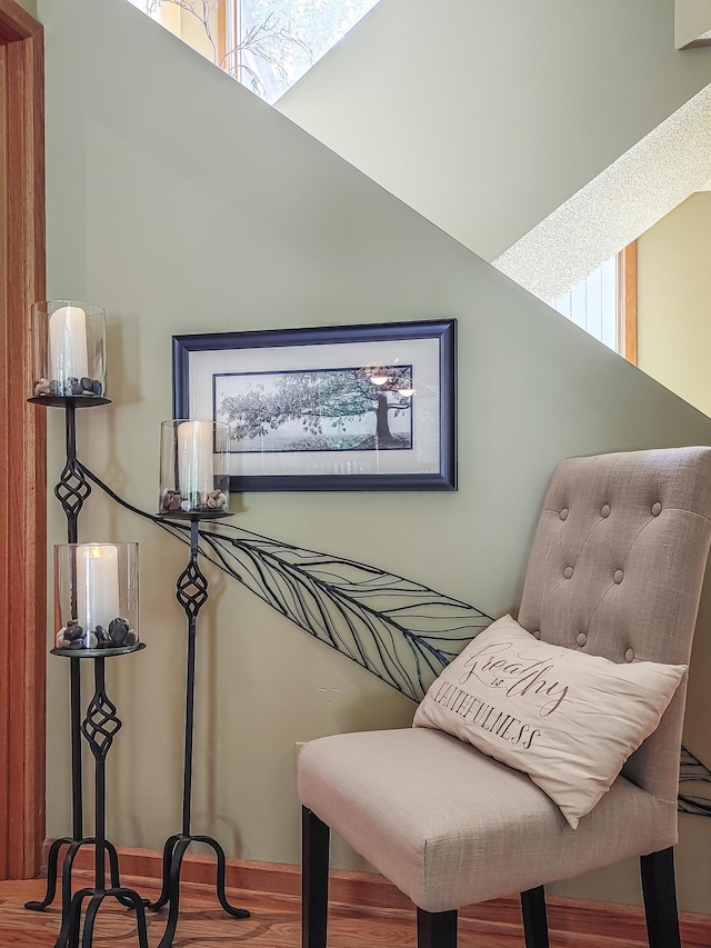 sitting room with a wealth of natural light and wood finished floors