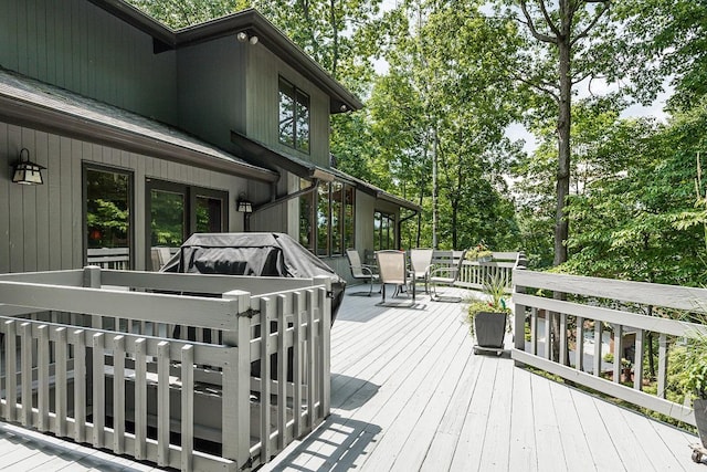 wooden deck with outdoor dining space