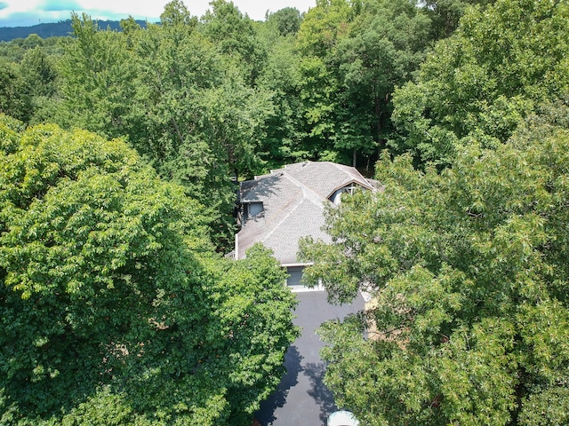 aerial view featuring a view of trees