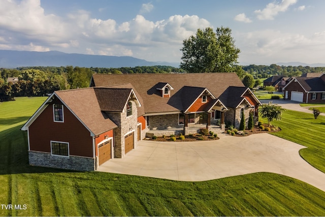 craftsman-style house with a front yard, stone siding, a garage, concrete driveway, and roof with shingles