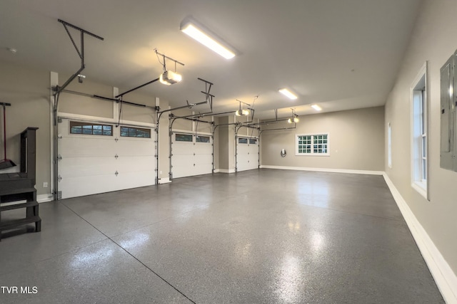 garage featuring baseboards and a garage door opener