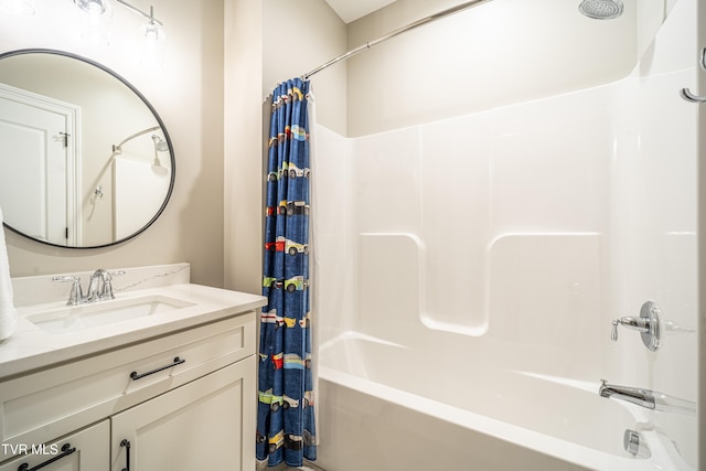 bathroom with shower / bathtub combination with curtain and vanity