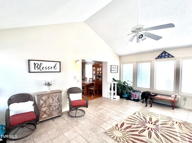 2215 Knob Creek Rd, Johnson City, TN 37604 - sitting room featuring light tile patterned floors, ceiling fan, high vaulted ceiling, and a textured ceiling