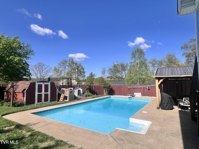2215 Knob Creek Rd, Johnson City, TN 37604 - view of pool with a storage shed, a fenced backyard, a patio, an outbuilding, and a fenced in pool