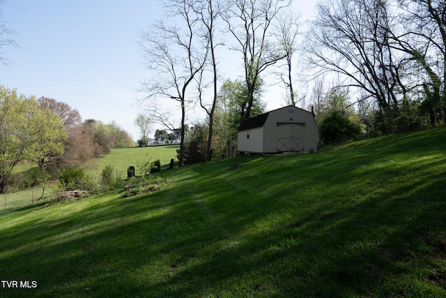 view of yard with a barn and an outdoor structure