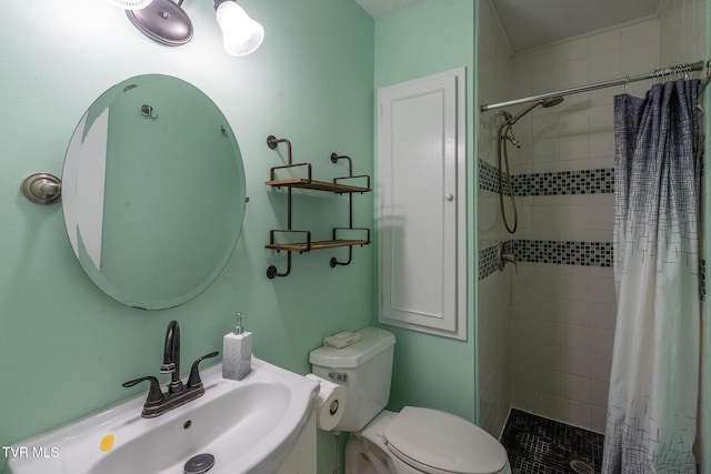 full bathroom with toilet, a sink, and a tile shower