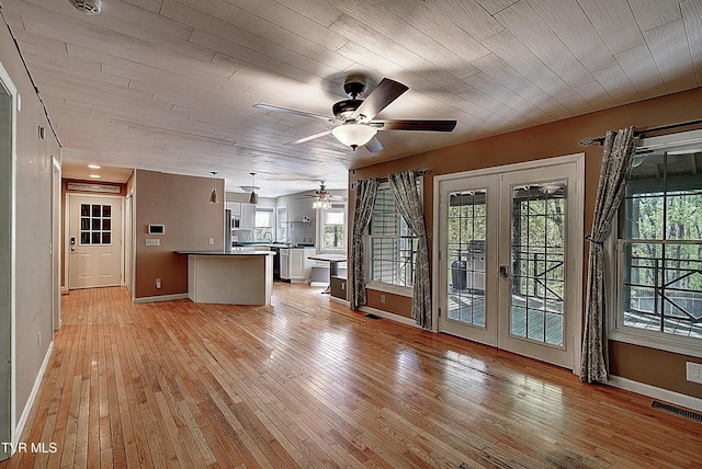 455 Carlton Rd, Bristol, TN 37620 - unfurnished living room with french doors, baseboards, visible vents, light wood-style floors, and a ceiling fan
