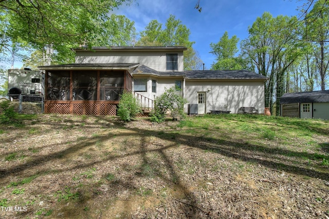 455 Carlton Rd, Bristol, TN 37620 - back of property featuring cooling unit, a sunroom, fence, and a lawn