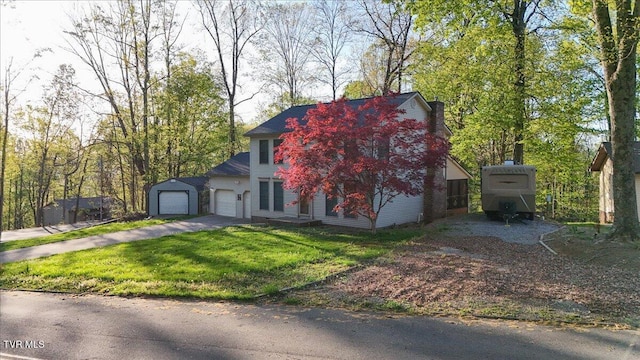 455 Carlton Rd, Bristol, TN 37620 - view of front facade featuring aphalt driveway, a front yard, and a garage