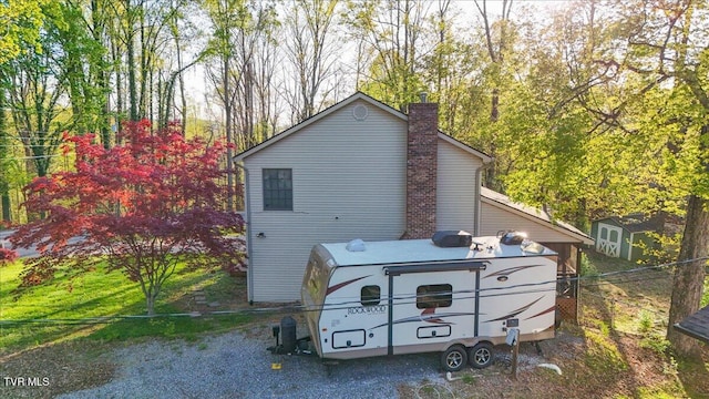 455 Carlton Rd, Bristol, TN 37620 - exterior space featuring an outbuilding, a shed, and a chimney