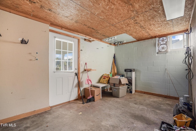 610 Pine Hill Rd, Elizabethton, TN 37643 - basement with baseboards, concrete block wall, and plenty of natural light