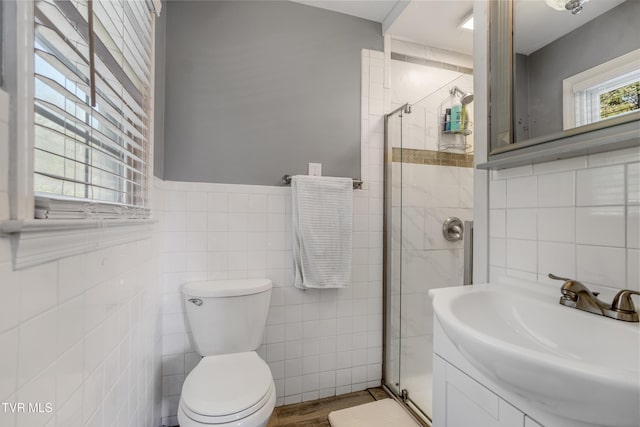 610 Pine Hill Rd, Elizabethton, TN 37643 - full bath with vanity, a wainscoted wall, toilet, a shower stall, and tile walls