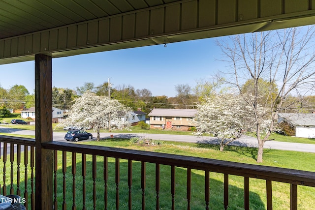 exterior space with a yard and a residential view