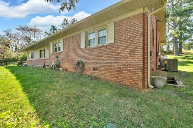 102 Delta Cir, Greeneville, TN 37743 - view of side of property featuring central AC, brick siding, and a yard