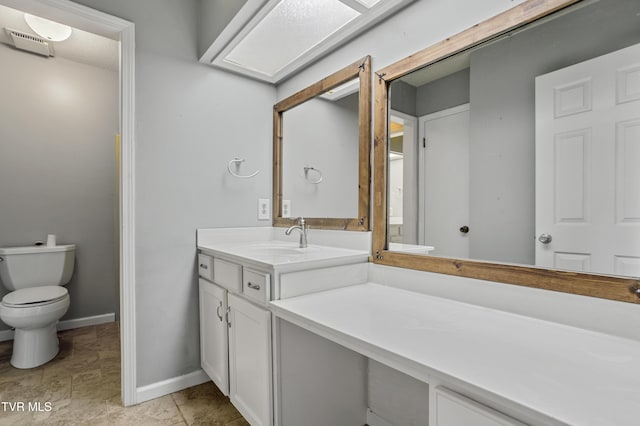 1023 Pebble Dr, Bristol, VA 24201 - bathroom with vanity, baseboards, visible vents, and toilet