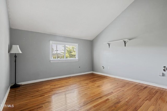 1023 Pebble Dr, Bristol, VA 24201 - empty room with baseboards, light wood-type flooring, and vaulted ceiling