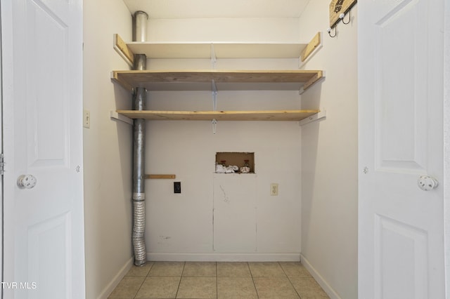 1023 Pebble Dr, Bristol, VA 24201 - laundry room with light tile patterned floors, baseboards, washer hookup, laundry area, and electric dryer hookup