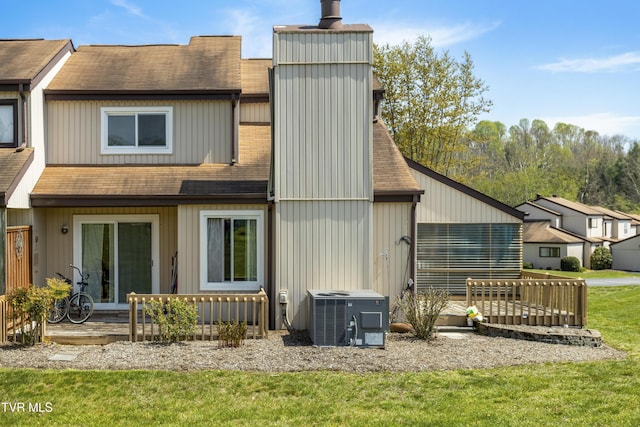 1023 Pebble Dr, Bristol, VA 24201 - rear view of house with a yard, roof with shingles, central AC, and a chimney