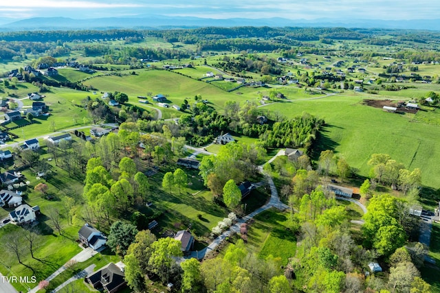 birds eye view of property with a rural view