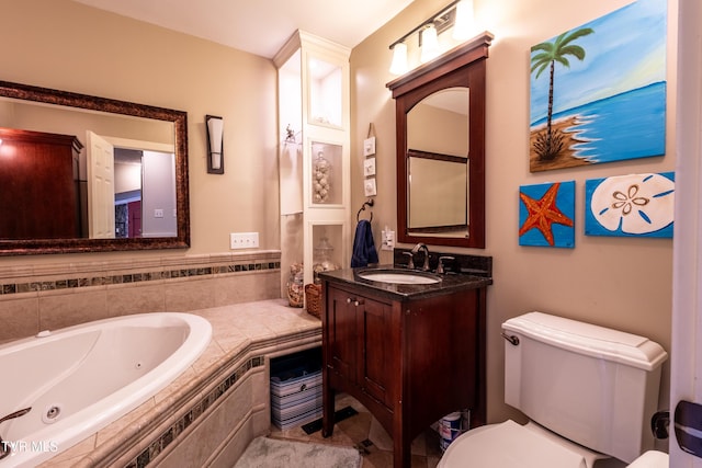 full bathroom with a tub with jets, toilet, and vanity