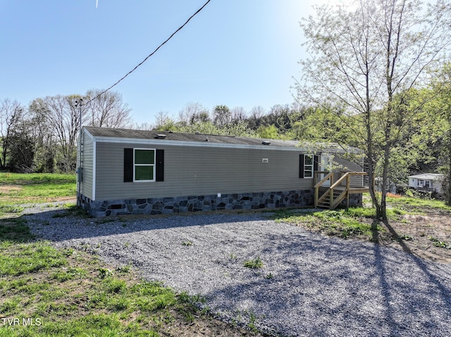 810 Sugar Bowl Rd, Chuckey, TN 37641 - back of property featuring crawl space and stairway