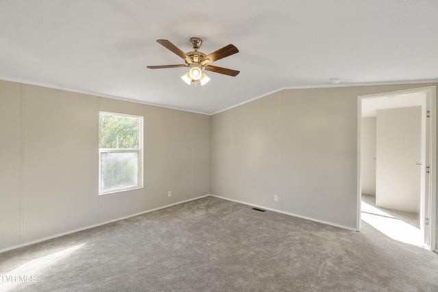 810 Sugar Bowl Rd, Chuckey, TN 37641 - carpeted spare room with baseboards, ornamental molding, visible vents, lofted ceiling, and ceiling fan