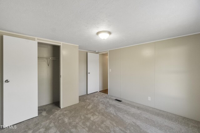 810 Sugar Bowl Rd, Chuckey, TN 37641 - unfurnished bedroom featuring a textured ceiling, visible vents, and carpet flooring