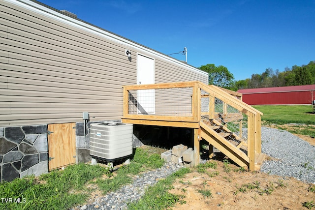 810 Sugar Bowl Rd, Chuckey, TN 37641 - view of side of home with central AC unit and a deck