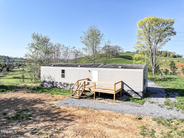810 Sugar Bowl Rd, Chuckey, TN 37641 - back of house featuring crawl space, an outbuilding, and a wooden deck