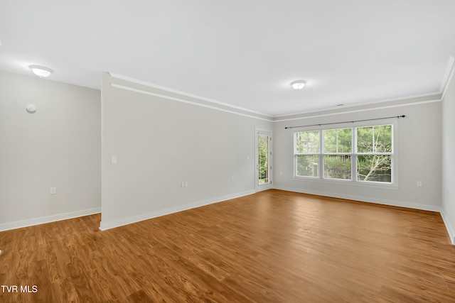 211 University Pkwy Unit 5, Johnson City, TN 37604 - spare room featuring ornamental molding, baseboards, and wood finished floors