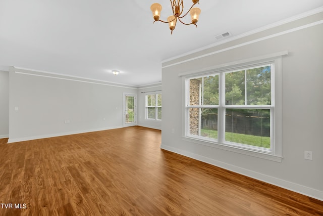 211 University Pkwy Unit 5, Johnson City, TN 37604 - unfurnished living room featuring visible vents, baseboards, and a chandelier