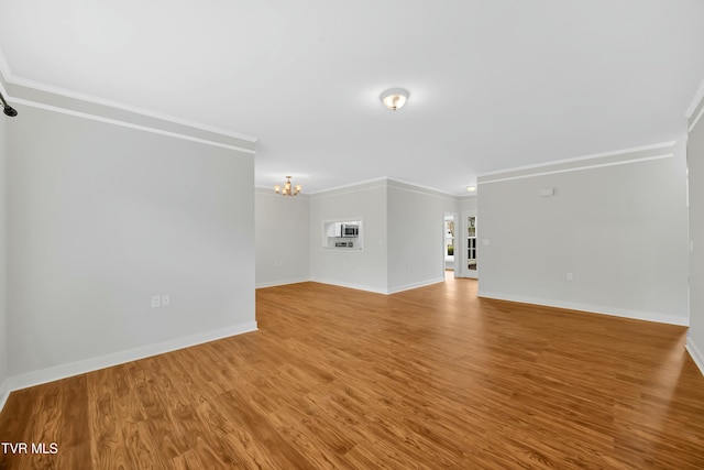 211 University Pkwy Unit 5, Johnson City, TN 37604 - unfurnished living room with a chandelier, wood finished floors, baseboards, and ornamental molding