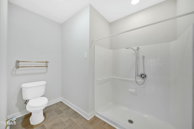 211 University Pkwy Unit 5, Johnson City, TN 37604 - bathroom featuring toilet, baseboards, and walk in shower