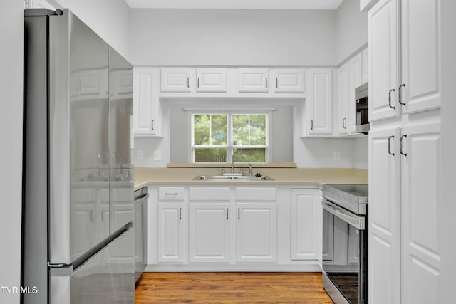 211 University Pkwy Unit 5, Johnson City, TN 37604 - kitchen with light countertops, a sink, white cabinetry, and appliances with stainless steel finishes