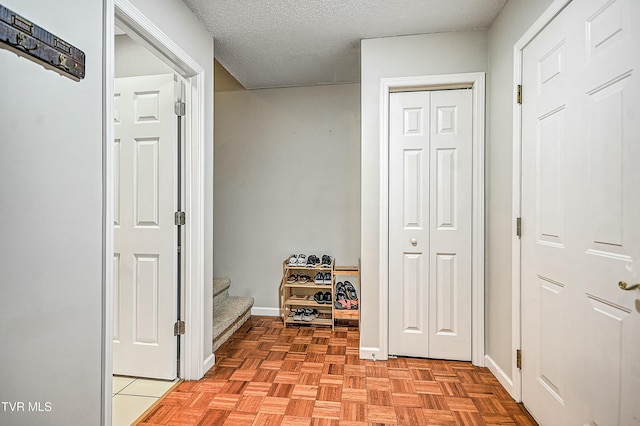 305 Waterford Ct Unit 305, Johnson City, TN 37615 - mudroom with baseboards and a textured ceiling