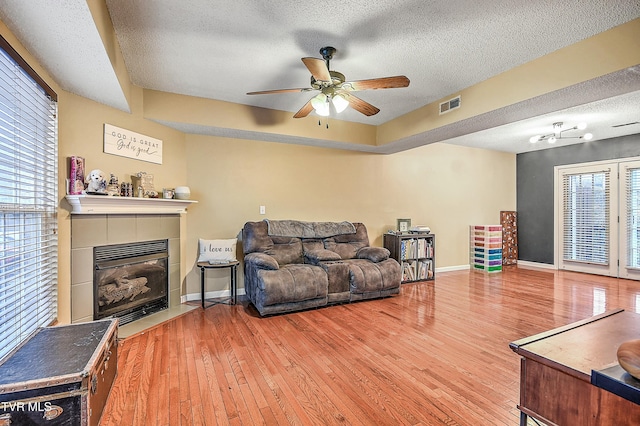 305 Waterford Ct Unit 305, Johnson City, TN 37615 - living room with a textured ceiling, wood finished floors, ceiling fan, and visible vents