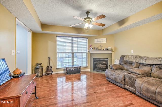 305 Waterford Ct Unit 305, Johnson City, TN 37615 - living room featuring a ceiling fan, plenty of natural light, wood finished floors, and a textured ceiling