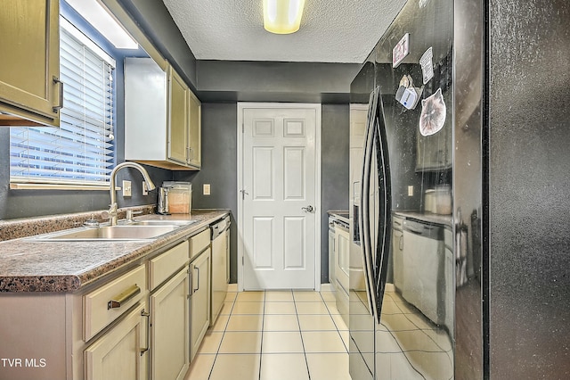 305 Waterford Ct Unit 305, Johnson City, TN 37615 - kitchen with stainless steel dishwasher, light tile patterned floors, dishwashing machine, a textured ceiling, and a sink