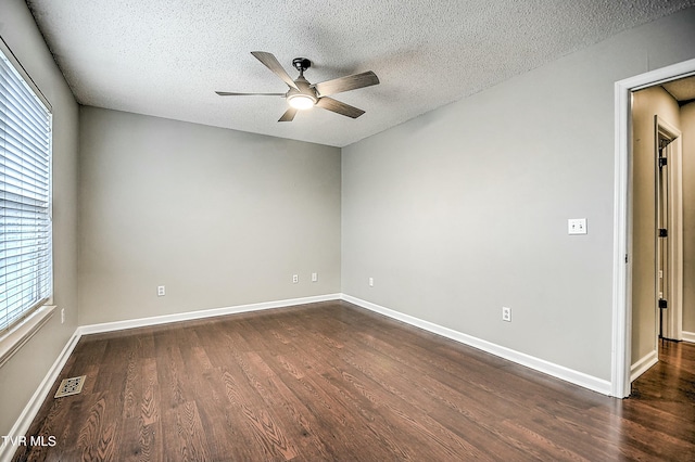 305 Waterford Ct Unit 305, Johnson City, TN 37615 - empty room with dark wood-style flooring, baseboards, a textured ceiling, visible vents, and ceiling fan