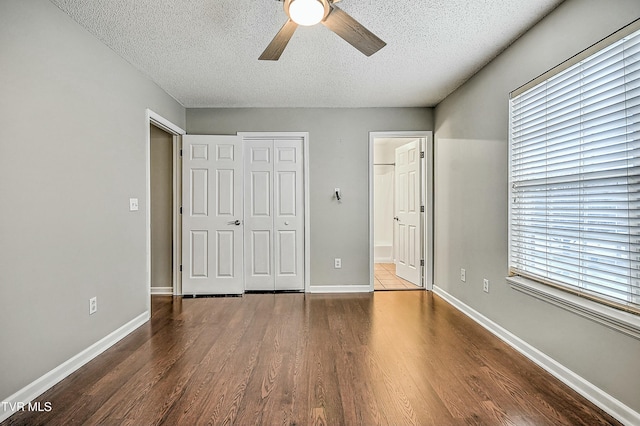 305 Waterford Ct Unit 305, Johnson City, TN 37615 - unfurnished bedroom with a closet, ensuite bathroom, a textured ceiling, a ceiling fan, and wood finished floors