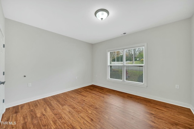 211 University Pkwy Unit 16, Johnson City, TN 37604 - unfurnished room with wood finished floors, baseboards, and visible vents