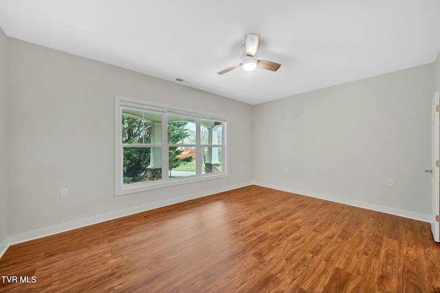 211 University Pkwy Unit 16, Johnson City, TN 37604 - unfurnished room with wood finished floors, baseboards, a ceiling fan, and visible vents