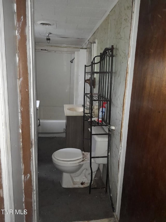 bathroom featuring visible vents, vanity, a shower, and toilet