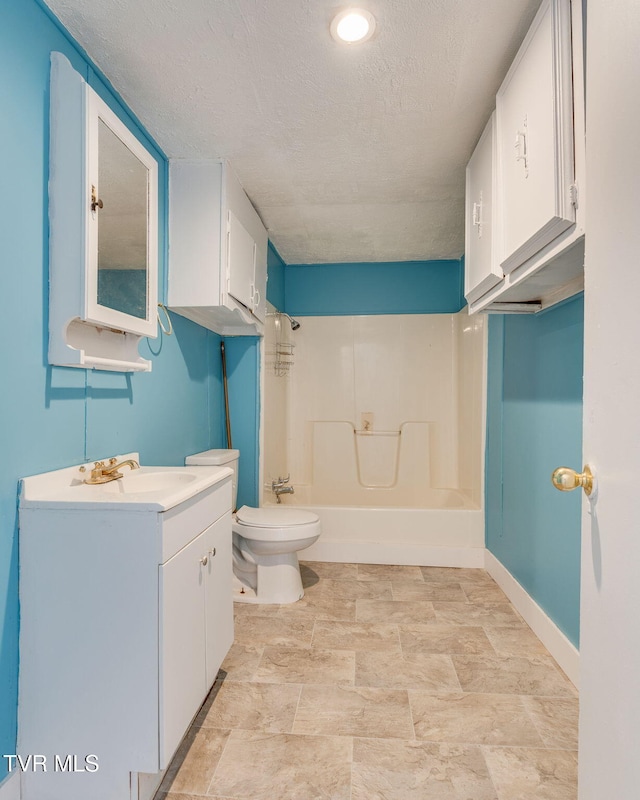 bathroom with baseboards, toilet, shower / bathing tub combination, a textured ceiling, and vanity
