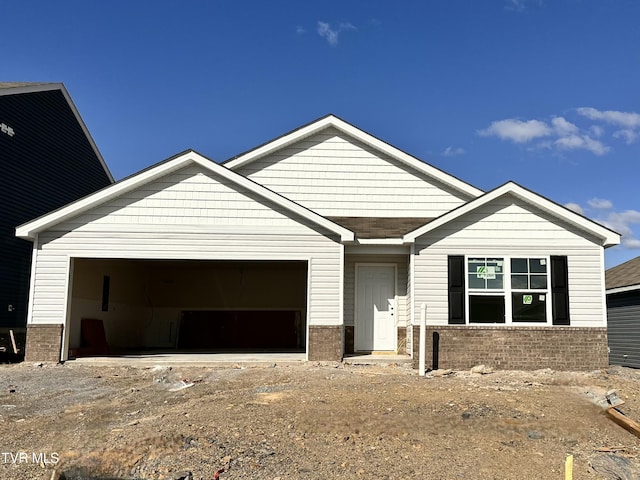109 Crawford Cir, Bristol, TN 37620 - view of front facade with driveway, brick siding, and a garage