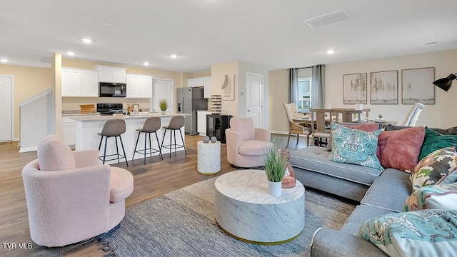 1905 Fox Meadows Cir, Bluff City, TN 37618 - living area with light wood-style flooring, recessed lighting, and baseboards
