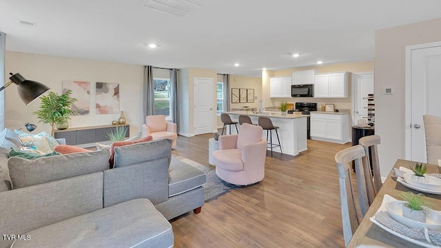 1905 Fox Meadows Cir, Bluff City, TN 37618 - living room with light wood-type flooring and recessed lighting