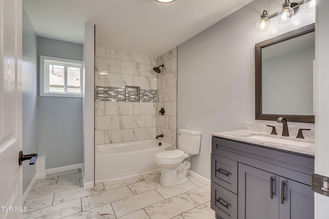 bathroom with marble finish flooring, toilet, baseboards, vanity, and bathtub / shower combination